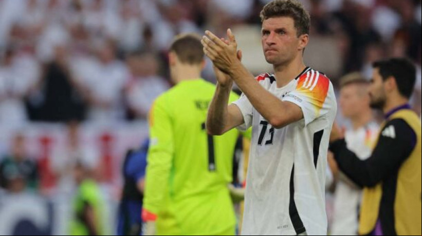 's forward #13 Thomas Mueller greets the fans after the UEFA Euro 2024 quarter-final football match between Spain and  at the Stuttgart Arena in Stuttgart on July 5, 2024. (Photo by LLUIS GENE / AFP) (Photo by LLUIS GENE/AFP via Getty Images) 