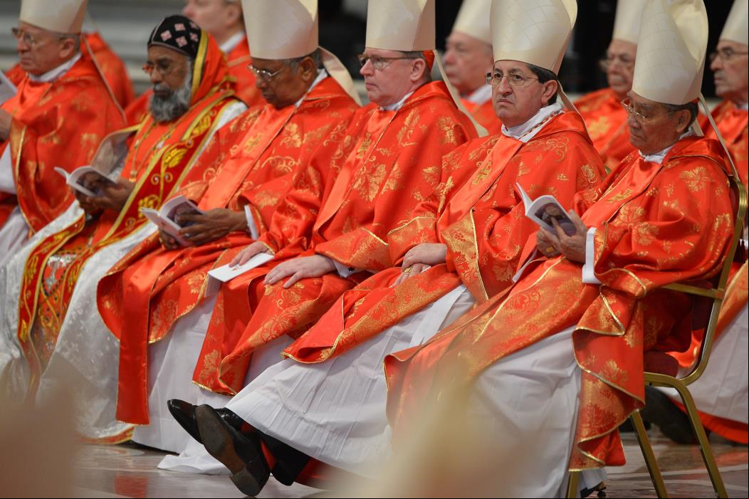 Cardinals attend a mass at the St Peter's basilica before the conclave on March 12, 2013 at the Vatican. Cardinals moved into the Vatican today as the suspense mounted ahead of a secret papal election with no clear frontrunner to steer the Catholic world through troubled waters after Benedict XVI's historic resignation.The 115 cardinal electors who pick the next leader of 1.2 billion Catholics in a conclave in the Sistine Chapel will live inside the Vatican walls completely cut off from the outside world until they have made their choice. AFP PHOTO / GABRIEL BOUYS